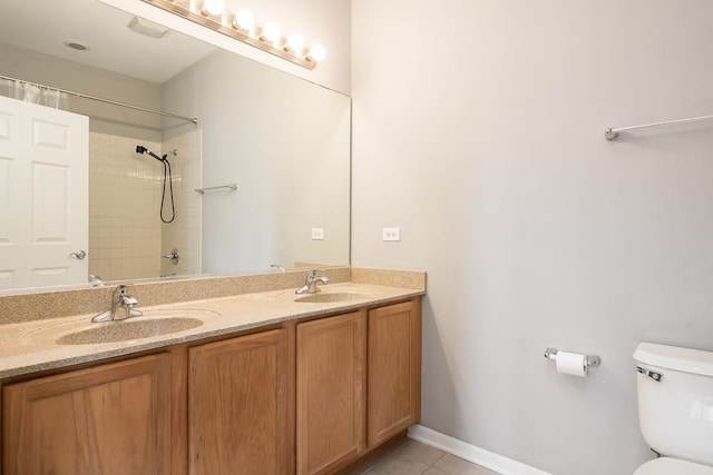 351 E 25th Pl Unit 20C, Chicago, IL 60616 - bathroom with double vanity, a shower, toilet, and tile patterned flooring