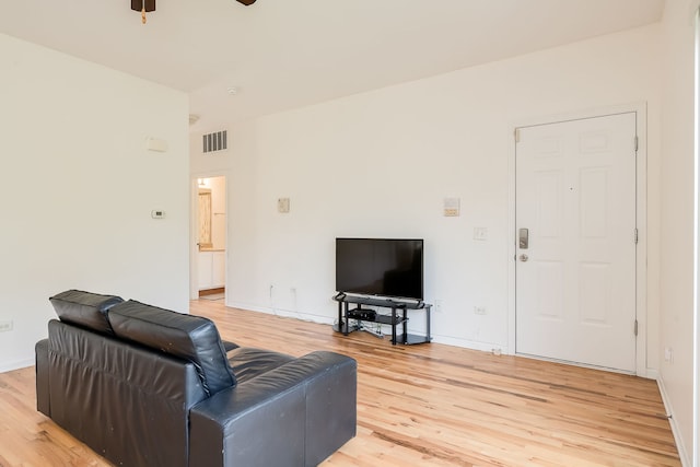 351 E 25th Pl Unit 20C, Chicago, IL 60616 - living room featuring light wood-type flooring, ceiling fan, and baseboards