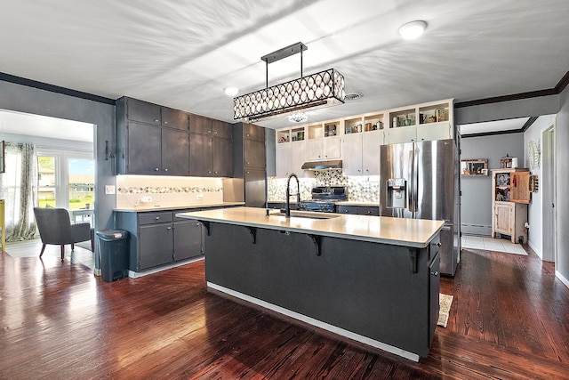 16527 S Ivy Ln, Plainfield, IL 60586 - kitchen with stainless steel refrigerator with ice dispenser, under cabinet range hood, crown molding, a sink, and light countertops