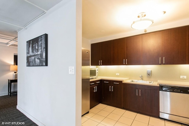 440 N Wabash Ave Unit 1103, Chicago, IL 60611 - kitchen featuring appliances with stainless steel finishes, light countertops, and dark brown cabinets