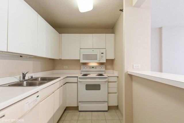 440 N Wabash Ave Unit 1103, Chicago, IL 60611 - kitchen featuring white appliances, light countertops, white cabinetry, light tile patterned floors, and a textured ceiling