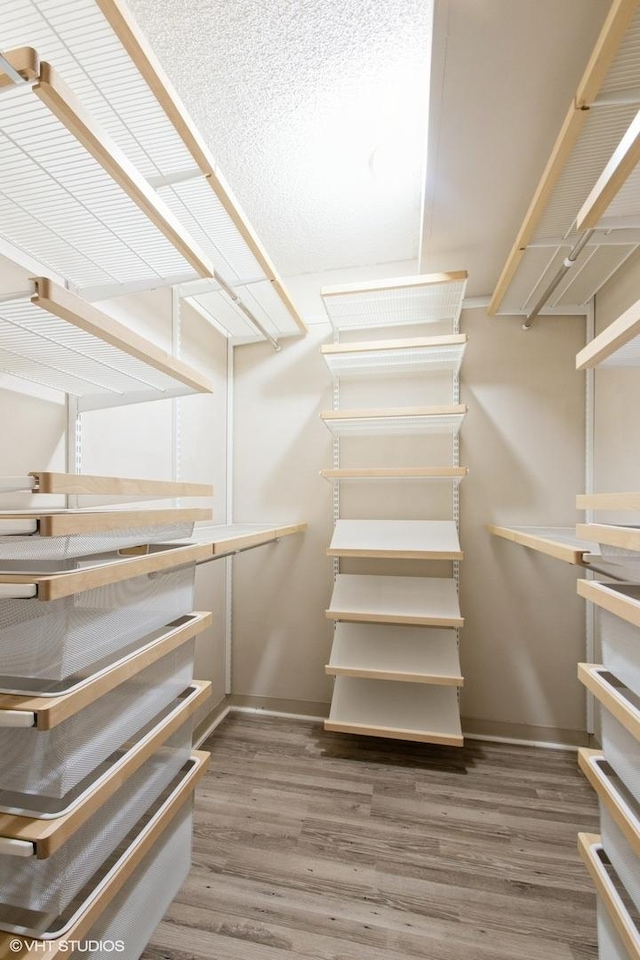 440 N Wabash Ave Unit 1103, Chicago, IL 60611 - walk in closet featuring wood finished floors