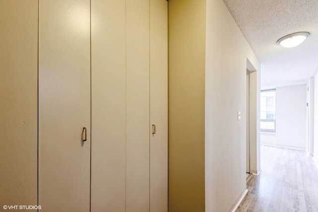 440 N Wabash Ave Unit 1103, Chicago, IL 60611 - hall featuring light wood-style flooring and a textured ceiling