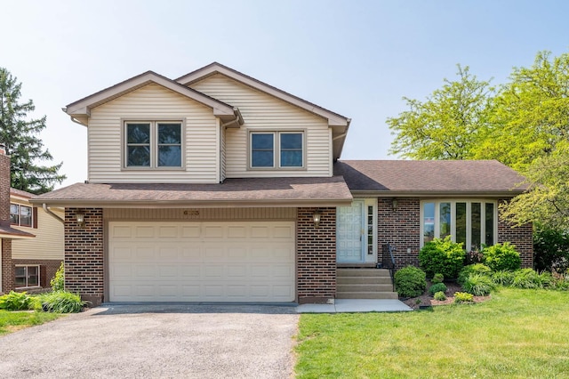 6133 Elm Ln, Matteson, IL 60443 - view of front of home featuring brick siding, asphalt driveway, an attached garage, and a front yard