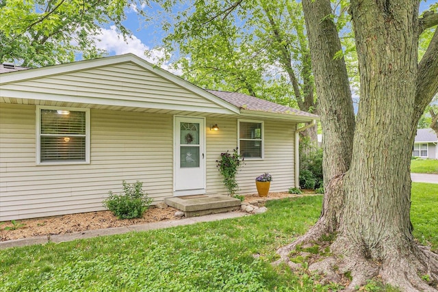 3310 Saratoga Dr, Champaign, IL 61821 - view of front of home with a front yard and a shingled roof