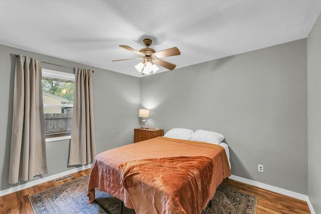 3310 Saratoga Dr, Champaign, IL 61821 - bedroom with baseboards, wood finished floors, and ceiling fan