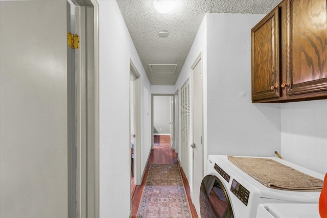 3310 Saratoga Dr, Champaign, IL 61821 - washroom featuring cabinet space, washing machine and dryer, a textured ceiling, attic access, and baseboards