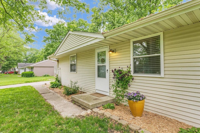 3310 Saratoga Dr, Champaign, IL 61821 - view of exterior entry featuring a lawn