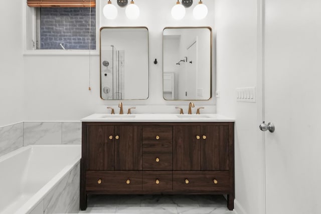 2023 W Rice St Unit 1E, Chicago, IL 60622 - bathroom featuring double vanity, a bath, and marble look tiles