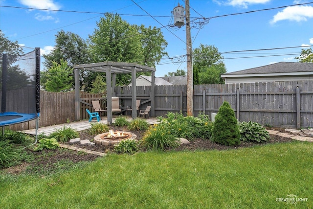 712 Cascade Ave, Romeoville, IL 60446 - view of yard featuring a trampoline and a fire pit