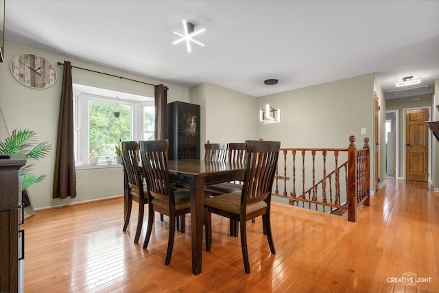 712 Cascade Ave, Romeoville, IL 60446 - dining room with light wood-style floors and baseboards