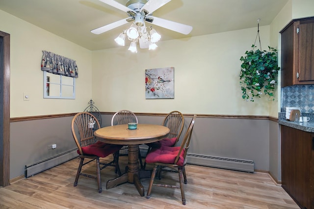 16028 Laramie Ave, Oak Forest, IL 60452 - dining room featuring a baseboard radiator, ceiling fan, and light wood finished floors