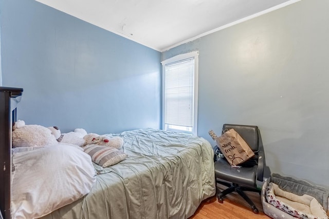 1909 Harvey Ave, Berwyn, IL 60402 - bedroom with ornamental molding, light wood finished floors, and multiple windows