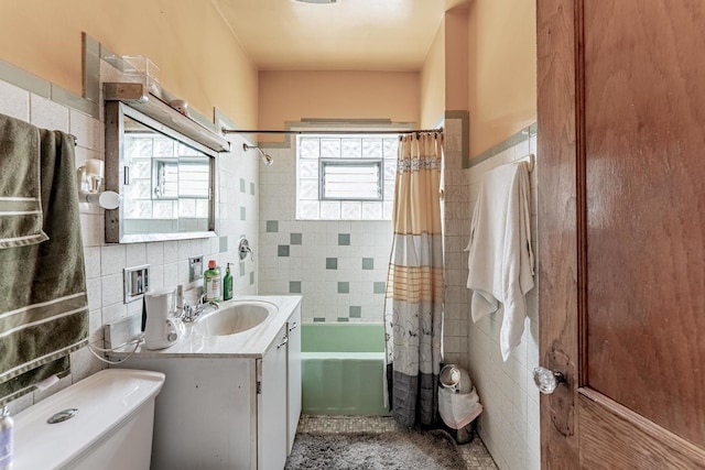 1909 Harvey Ave, Berwyn, IL 60402 - bathroom with tile walls, vanity, toilet, shower / bath combination with curtain, and tile patterned floors