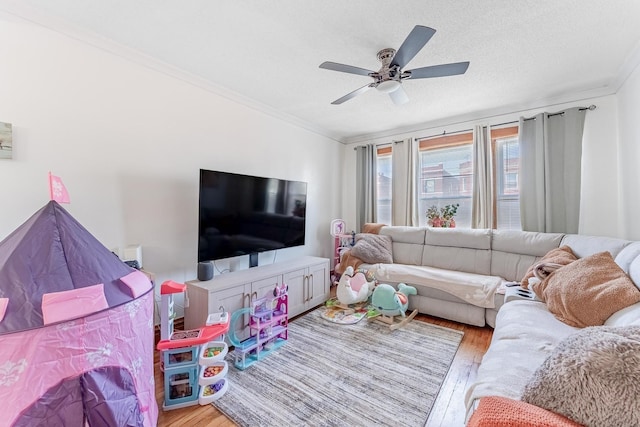 1909 Harvey Ave, Berwyn, IL 60402 - living room featuring wood finished floors, crown molding, and a ceiling fan