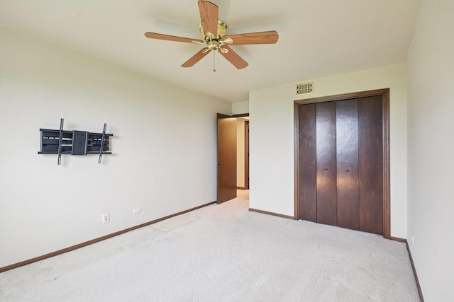 1S150 Spring Rd Unit 5F, Oakbrook Terrace, IL 60181 - unfurnished bedroom with light colored carpet, baseboards, a closet, and ceiling fan