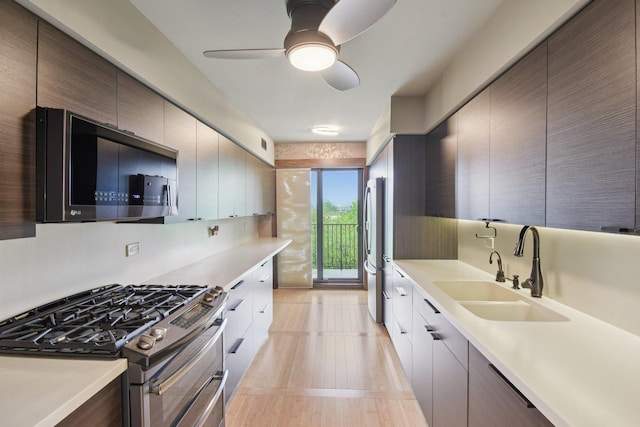 1S150 Spring Rd Unit 5F, Oakbrook Terrace, IL 60181 - kitchen featuring stainless steel appliances, a sink, light countertops, ceiling fan, and modern cabinets