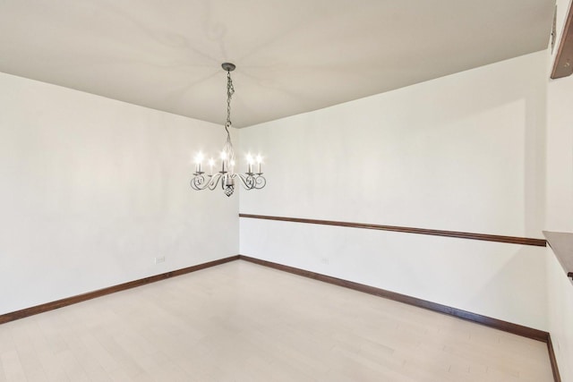 1S150 Spring Rd Unit 5F, Oakbrook Terrace, IL 60181 - empty room with a chandelier and baseboards
