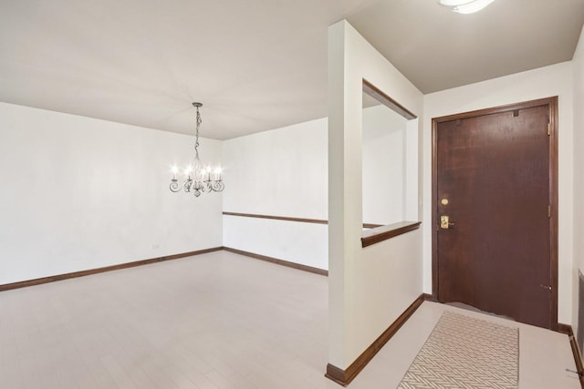 1S150 Spring Rd Unit 5F, Oakbrook Terrace, IL 60181 - foyer entrance featuring baseboards and a chandelier