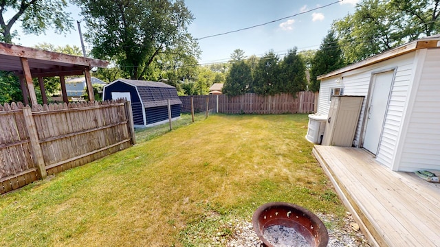 130 Syril Dr, Geneva, IL 60134 - fenced backyard featuring an outbuilding and a wooden deck