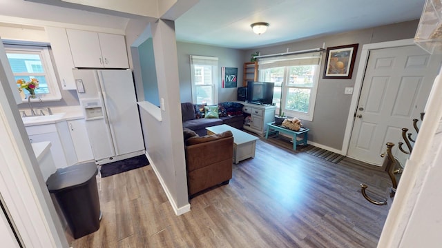 130 Syril Dr, Geneva, IL 60134 - living area with light wood-style flooring and baseboards