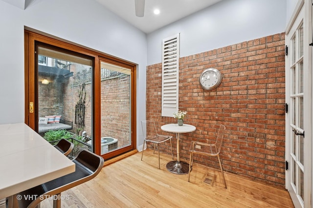 1636 N Cleveland Ave, Chicago, IL 60614 - dining space with brick wall, wood finished floors, a ceiling fan, and recessed lighting