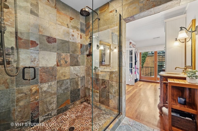 1636 N Cleveland Ave, Chicago, IL 60614 - full bathroom featuring a shower stall, vanity, and wood finished floors