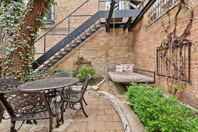 1636 N Cleveland Ave, Chicago, IL 60614 - view of patio / terrace with outdoor dining space and stairs