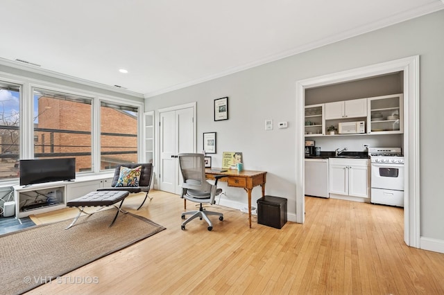 1636 N Cleveland Ave, Chicago, IL 60614 - office featuring crown molding, light wood-style flooring, a sink, recessed lighting, and baseboards