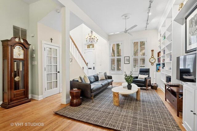 1636 N Cleveland Ave, Chicago, IL 60614 - living area featuring wood finished floors, stairway, ceiling fan, and baseboards