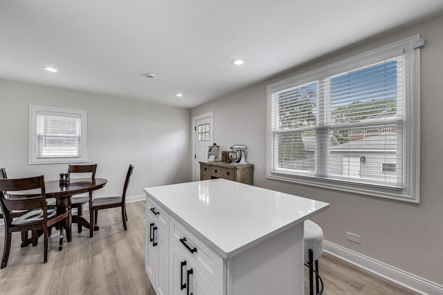 529 Circle Ave, Forest Park, IL 60130 - kitchen featuring light wood finished floors, white cabinetry, a center island, recessed lighting, and light countertops