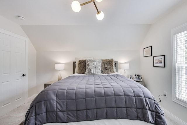 529 Circle Ave, Forest Park, IL 60130 - carpeted bedroom featuring lofted ceiling, baseboards, and multiple windows