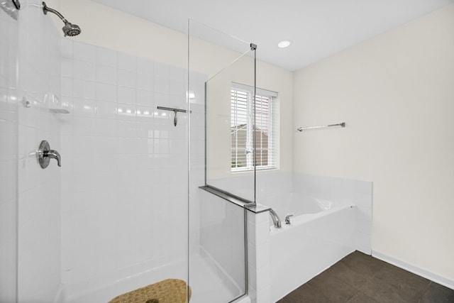 192 Owen St, Matteson, IL 60443 - bathroom featuring tiled shower, a bath, tile patterned floors, and baseboards