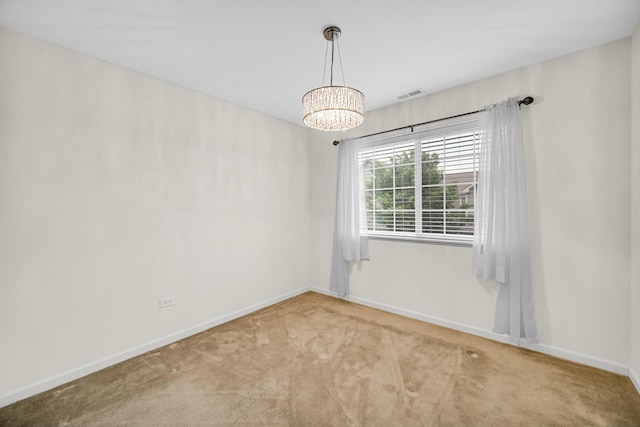 192 Owen St, Matteson, IL 60443 - carpeted spare room with baseboards and a chandelier