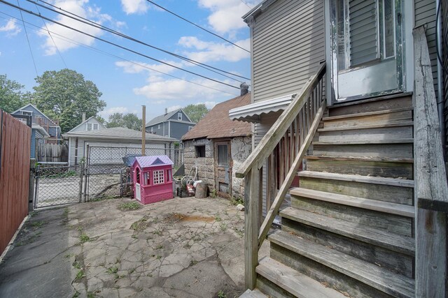 9620 S Exchange Ave, Chicago, IL 60617 - view of yard with a gate, a garage, and a patio