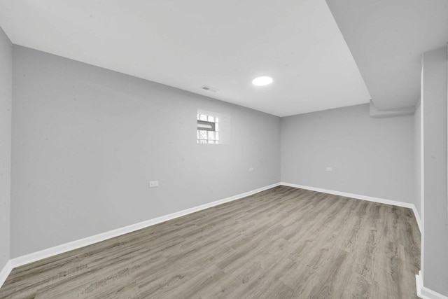 8429 S Ada St, Chicago, IL 60620 - below grade area featuring wood finished floors, baseboards, and recessed lighting