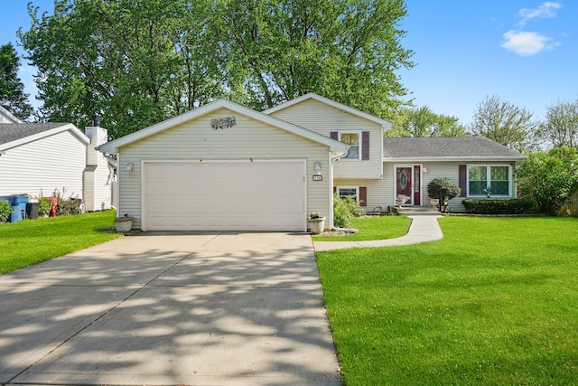 136 Anita Dr, Bourbonnais, IL 60914 - tri-level home with a front yard, a garage, and concrete driveway