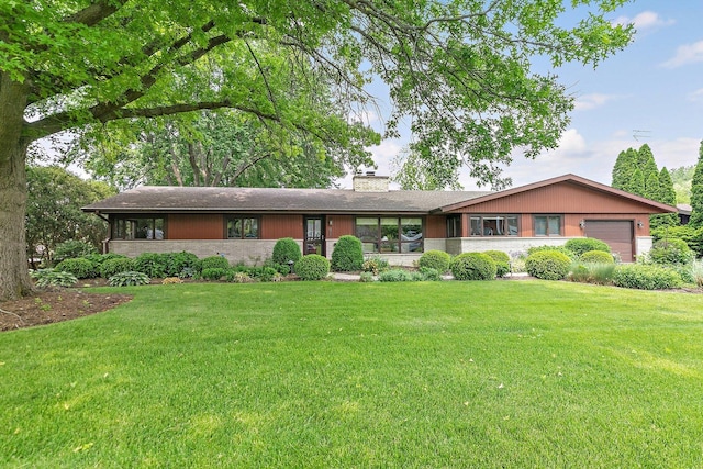 115 Thornbrook Rd, Dekalb, IL 60115 - ranch-style home featuring a garage, a chimney, and a front lawn