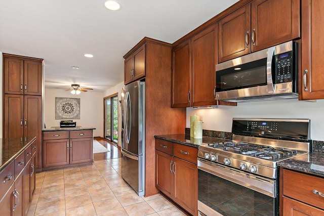 115 Thornbrook Rd, Dekalb, IL 60115 - kitchen featuring appliances with stainless steel finishes, dark stone counters, recessed lighting, a ceiling fan, and light tile patterned flooring