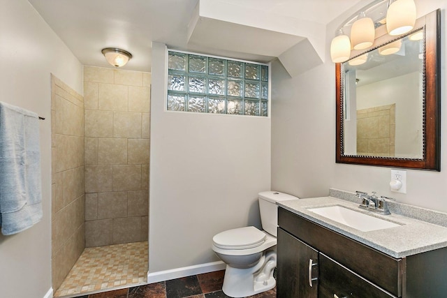 115 Thornbrook Rd, Dekalb, IL 60115 - full bath featuring vanity, a tile shower, toilet, and stone finish floors