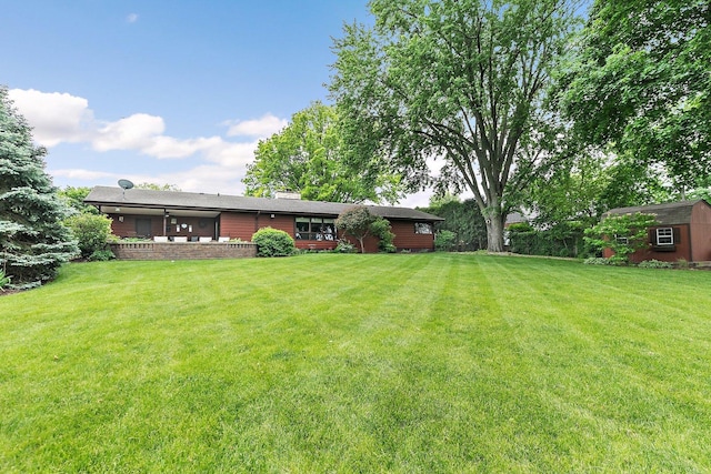 115 Thornbrook Rd, Dekalb, IL 60115 - view of green lawn featuring a deck