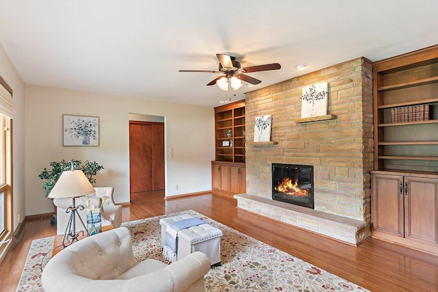 115 Thornbrook Rd, Dekalb, IL 60115 - living area with baseboards, built in shelves, wood finished floors, and ceiling fan
