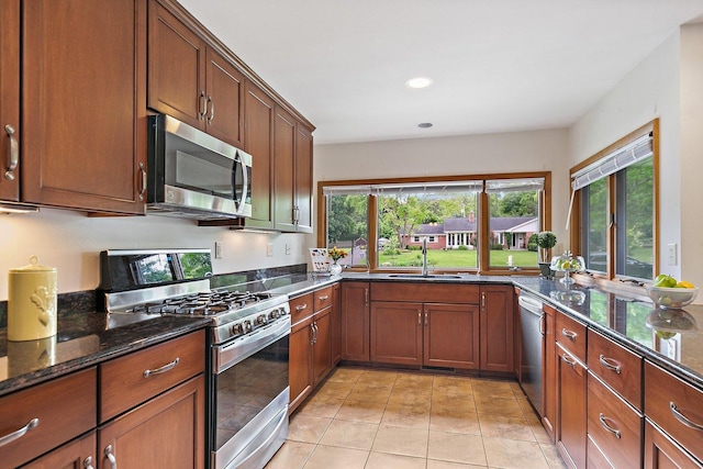 115 Thornbrook Rd, Dekalb, IL 60115 - kitchen with stainless steel appliances, a sink, plenty of natural light, dark stone countertops, and recessed lighting