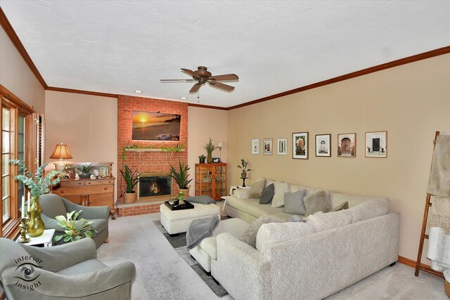 21048 Tall Grass Dr, Mokena, IL 60448 - living area with light colored carpet, a ceiling fan, a fireplace, crown molding, and baseboards