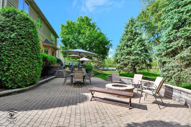 21048 Tall Grass Dr, Mokena, IL 60448 - view of patio / terrace with an outdoor fire pit