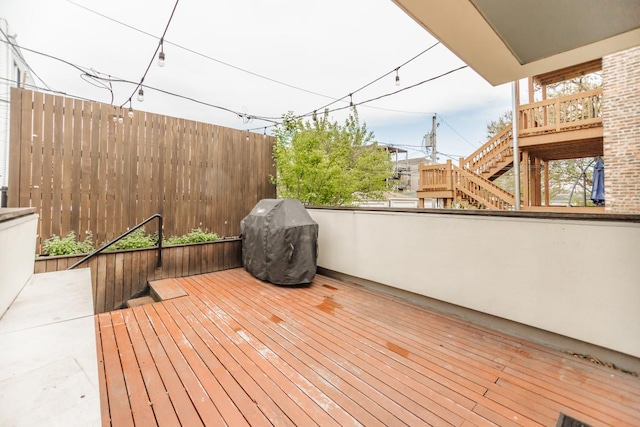 4805 S Langley Ave, Chicago, IL 60615 - wooden deck with area for grilling and stairway