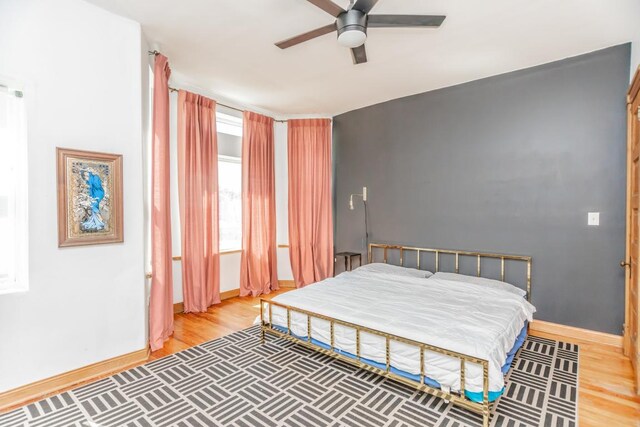 4805 S Langley Ave, Chicago, IL 60615 - bedroom featuring baseboards, light wood-style flooring, and ceiling fan
