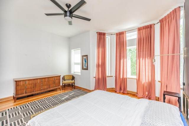 4805 S Langley Ave, Chicago, IL 60615 - bedroom featuring wood finished floors, baseboards, and a ceiling fan