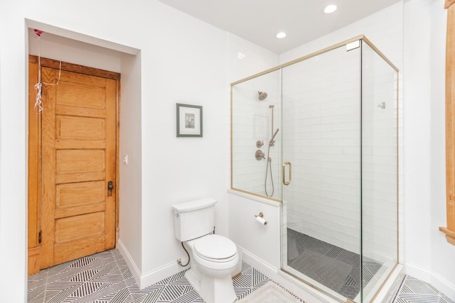 4805 S Langley Ave, Chicago, IL 60615 - bathroom featuring a shower stall, toilet, recessed lighting, baseboards, and tile patterned floors