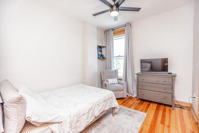 4805 S Langley Ave, Chicago, IL 60615 - bedroom with wood finished floors and a ceiling fan